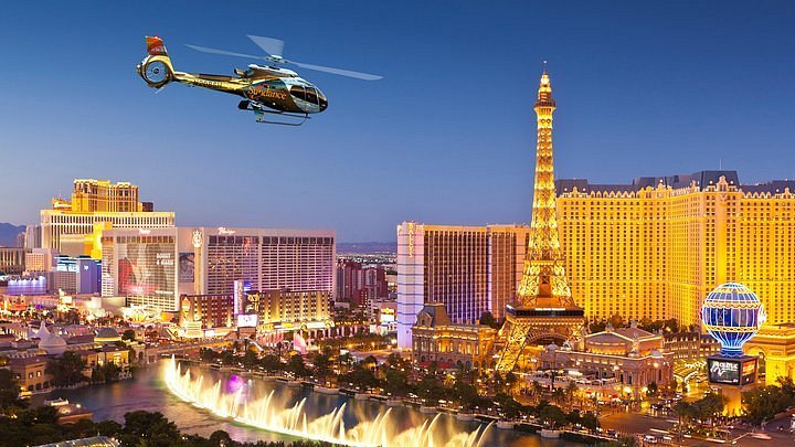 Helicopter flying over the Las Vegas Strip at dusk